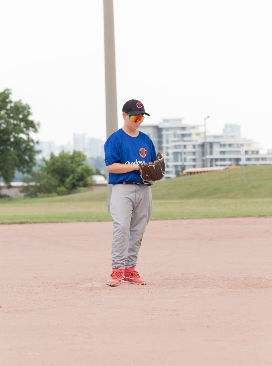 Young pitcher in the set position, real game