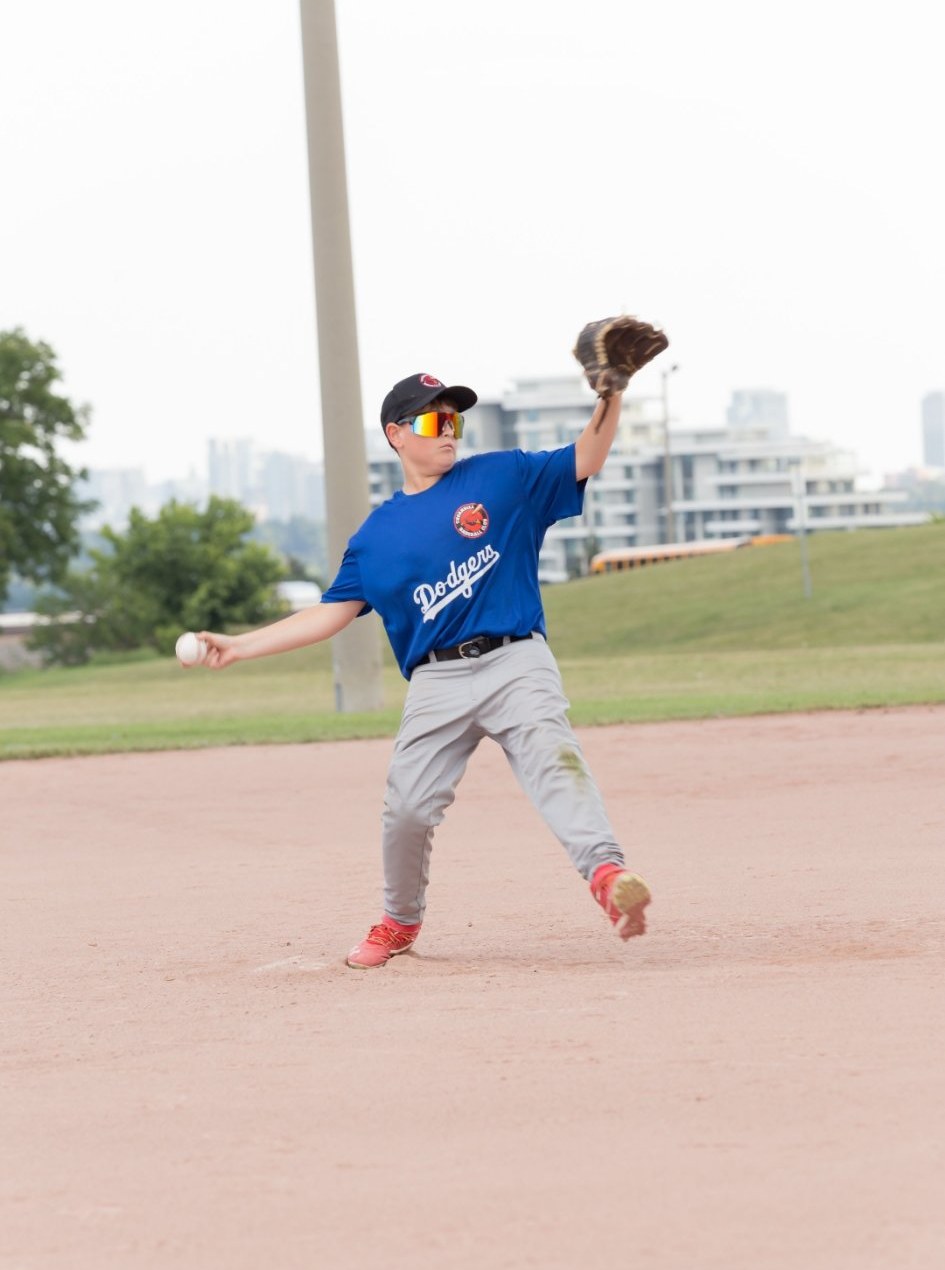Young pitcher at ball release, real game